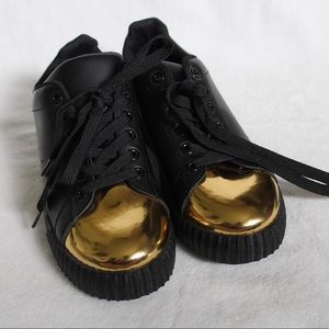 Black and gold sneakers